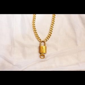 Louis Vuitton lock and key on a Cuban link necklace